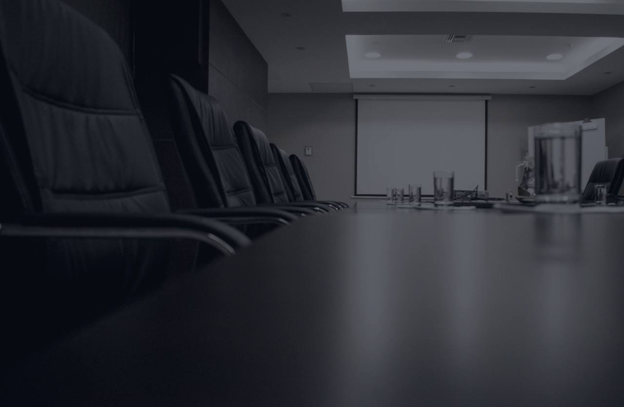 An empty boardroom table, seen from a low angle